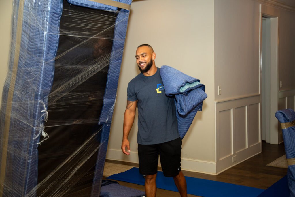 Mover, Larry getting ready to wrap and protect the sofa.